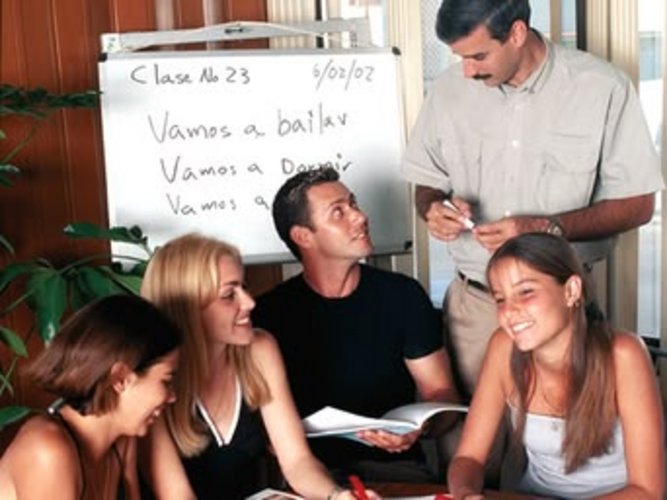 students practicing Spanish with instructor in Havana